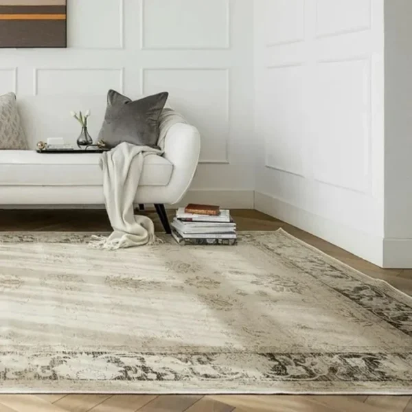 Faded grey-beige rug with abstract wear