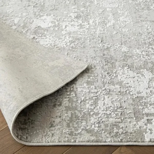 Rug with abstract grey distressed design