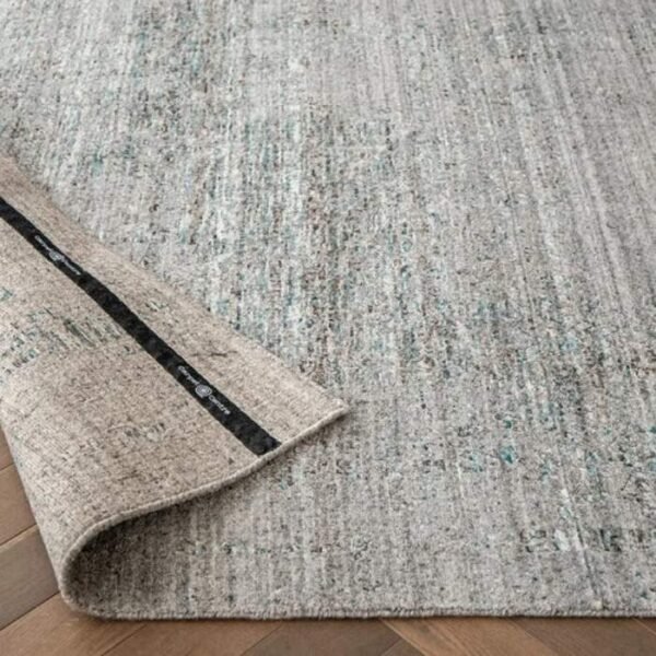 Rug with abstract faded grey design
