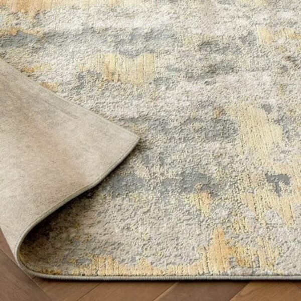 Grey and gold rug with abstract design