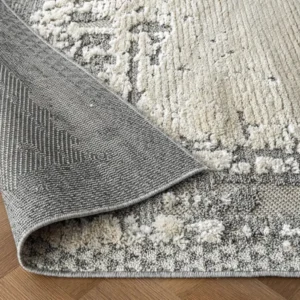 Beige rust abstract rug in living room