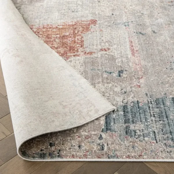 Beige rust abstract rug in living room