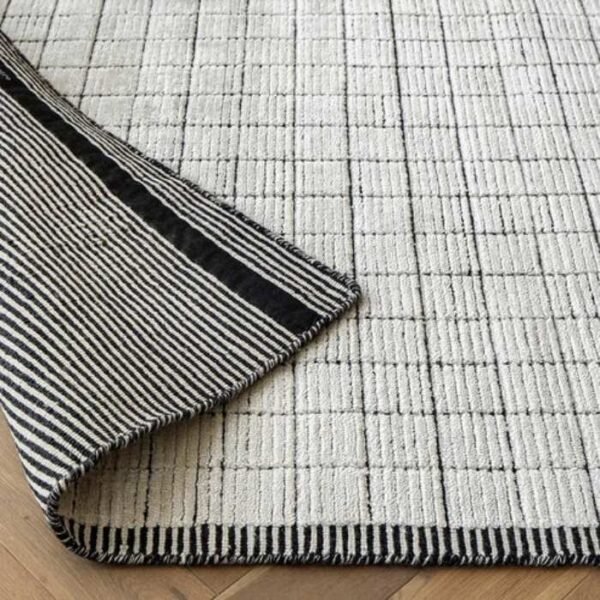 Black and white rug with grid design