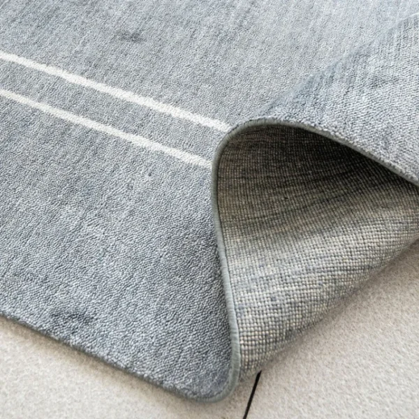 Stylish blue white border dining rug