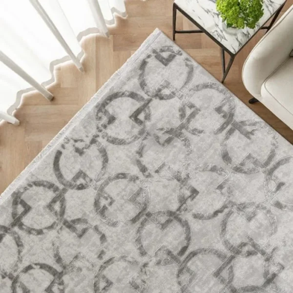 Grey rug with bold geometric shapes