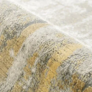 Designer rug with abstract grey-gold palette
