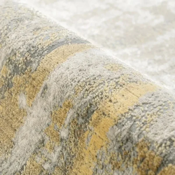 Designer rug with abstract grey-gold palette