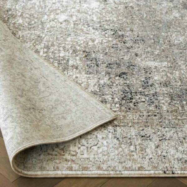 Grey and beige rug with abstract pattern