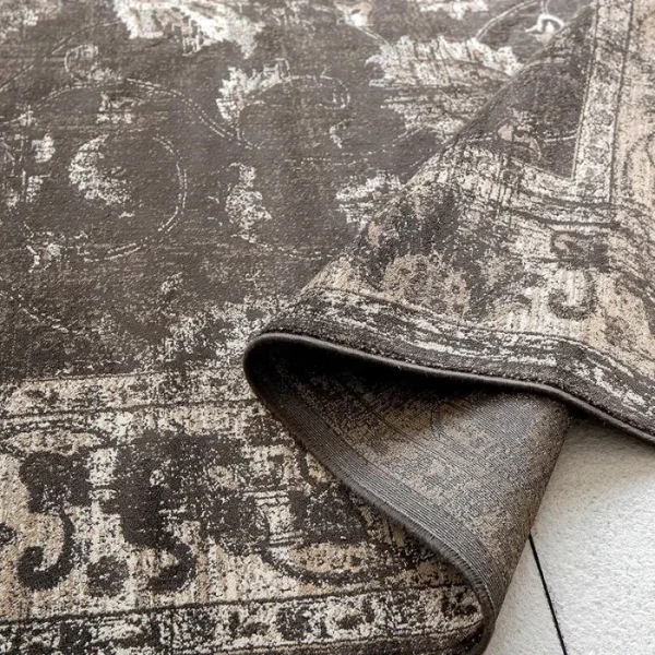 distressed brown rug in living room