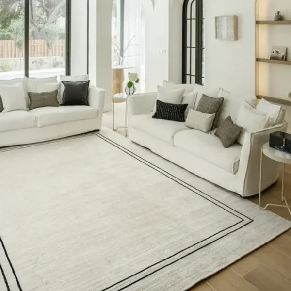 Durable pearl black border rug