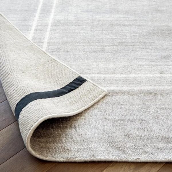 White bordered grey rug design
