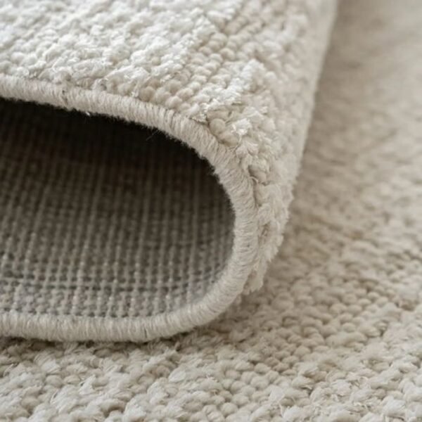 Smooth ivory rug for living spaces
