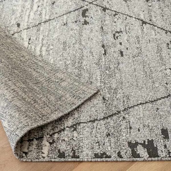 Faded base rug with criss-cross lines