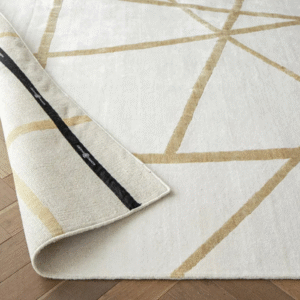 Rug with gold crossed line pattern