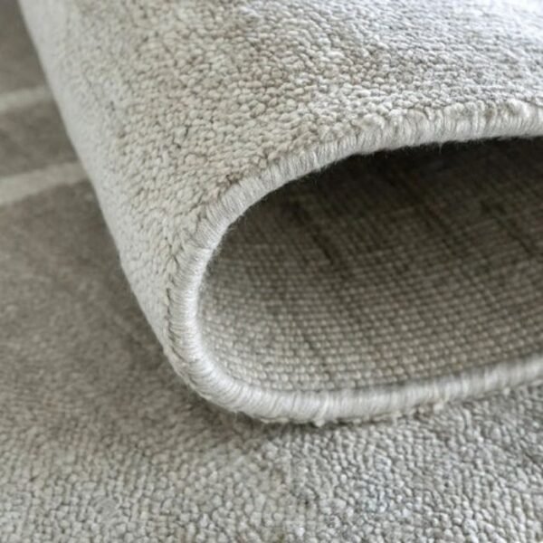Soft grey rug with border design
