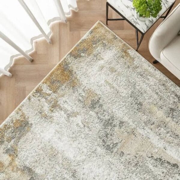 Abstract area rug with gold streaks on grey