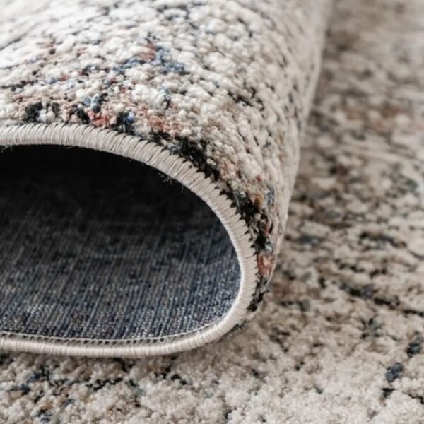 Rug with faded traditional motif design