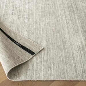 Rug with thick, raised textured surface