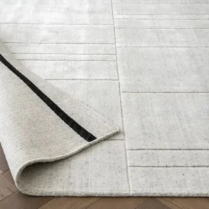 Light grey rug with tufted line texture