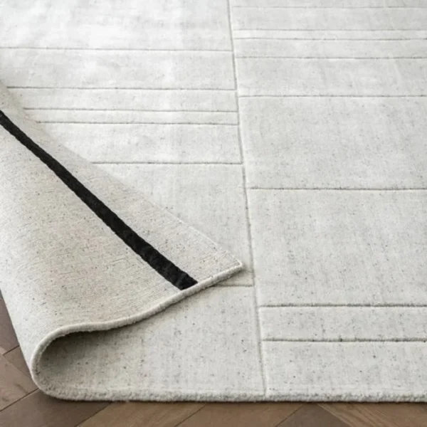 Light grey rug with tufted line texture