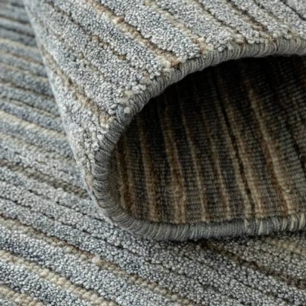 Textured surface rug with narrow stripes