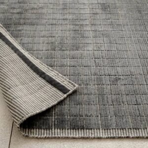 Rug with raised textured grid pattern