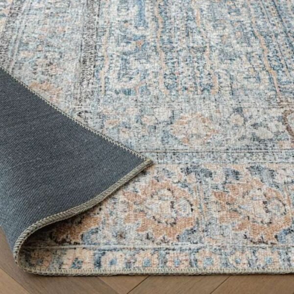 Faded rug with repeating medallion design