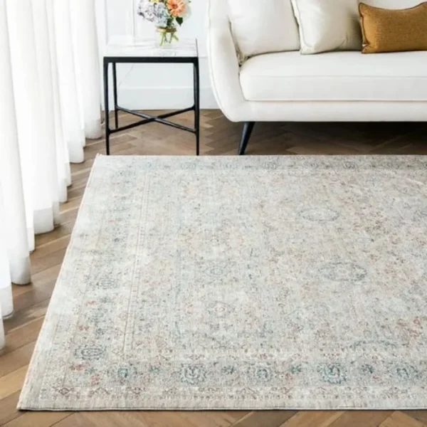 Repeating traditional patterned rug in room
