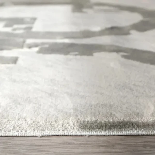 Area rug in grey with sharp geometric edges
