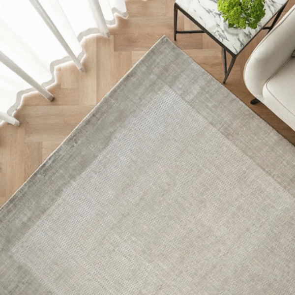 Side angle view showing texture of Mesh Taupe Rug