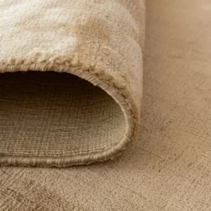 Side angle of ombré stripes rug showing color transition