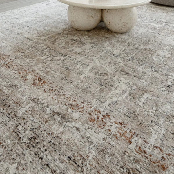 Rug edge showing soft faded tones