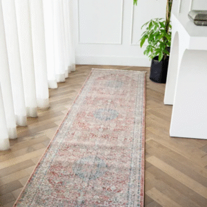 Corner of rug with faded red edges