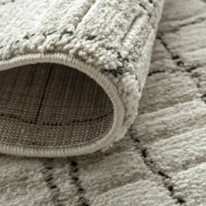 Wavy grid textured rug in cozy bedroom
