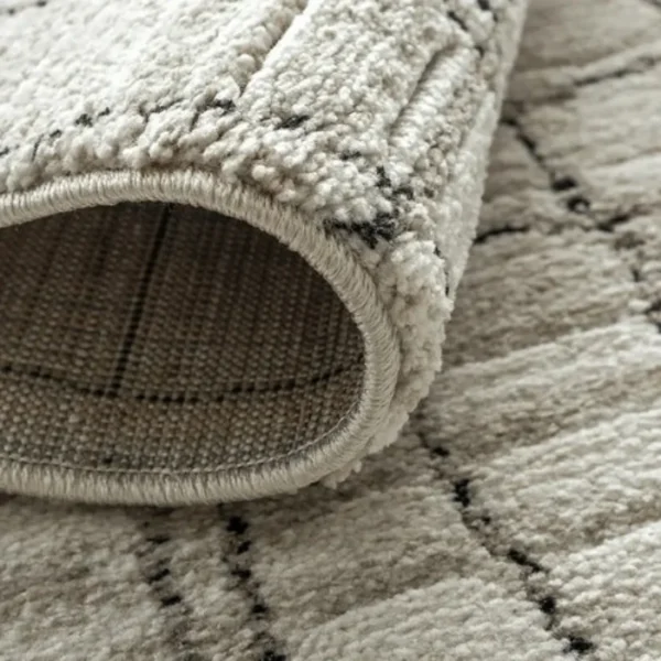 Wavy grid textured rug in cozy bedroom