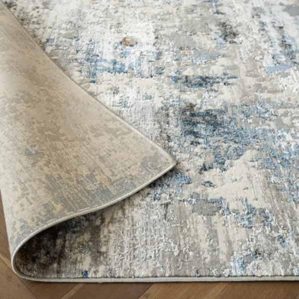 Rug with stripped base and blurred fade