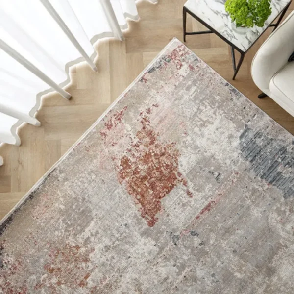 Beige rust abstract rug in dining space