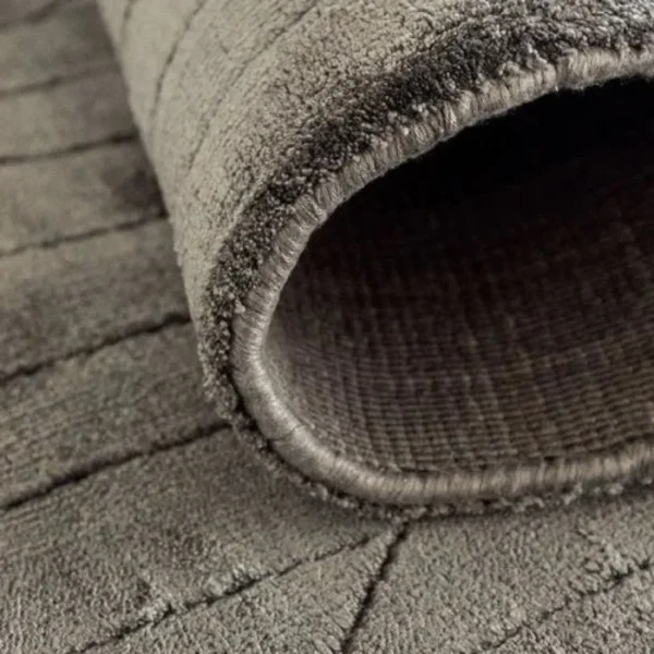 Textured carved plaited lines rug