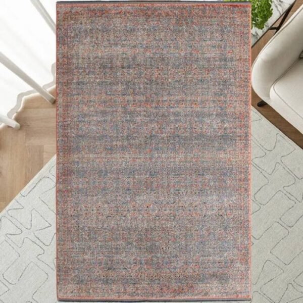 Top view of full faded patterned rug