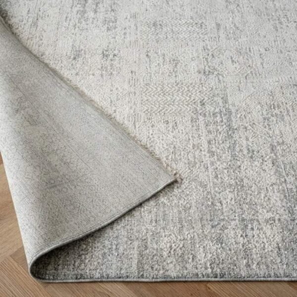 Rug with faded traditional pattern design
