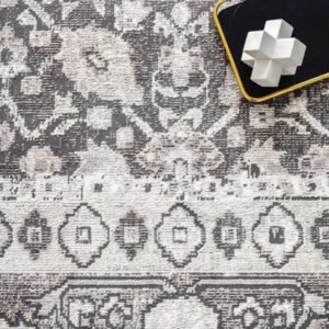 Soft grey tribal rug with vintage shading