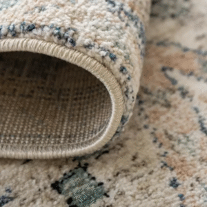 Corner view of faded diamond rug