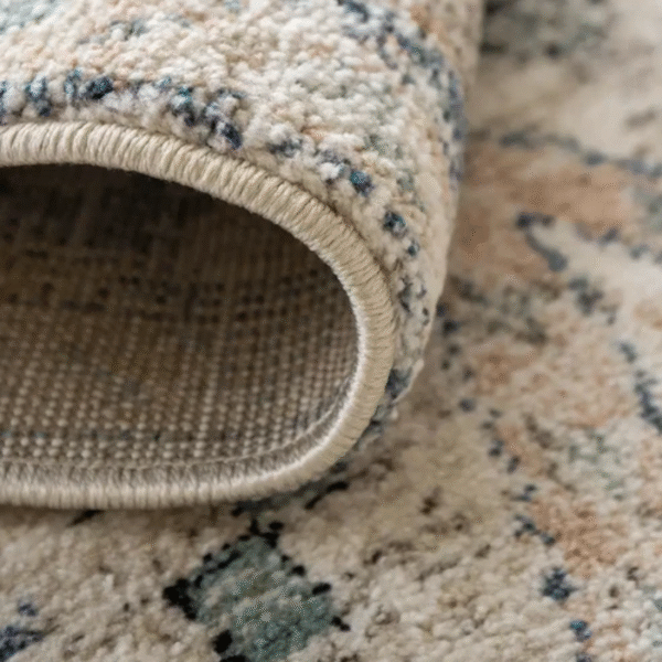 Corner view of faded diamond rug