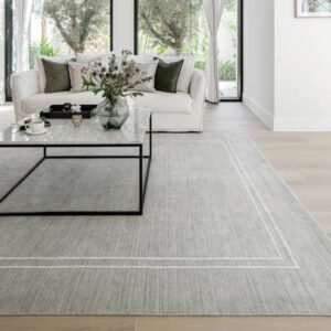 Grey rug featuring white edge border