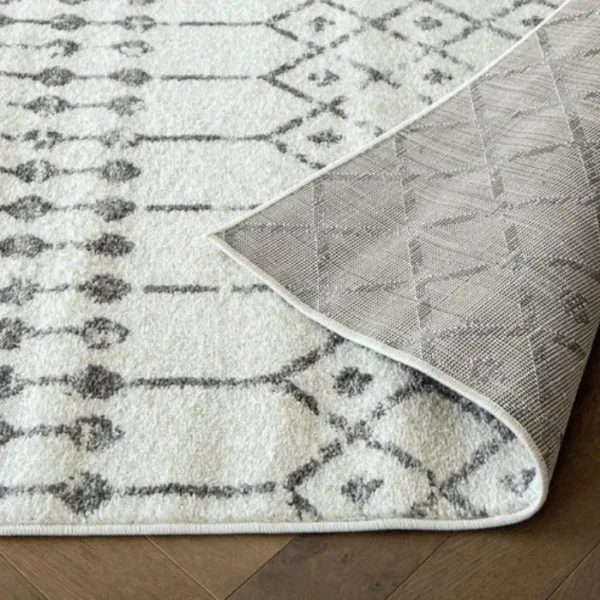 White and grey folk rug in living room