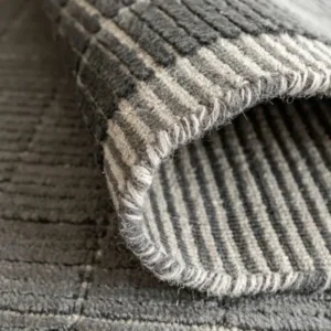 Rug with woven texture and grid pattern