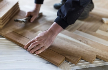 Professional laying of herringbone floor tiles