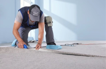 Natural wool carpet installation in modern home
